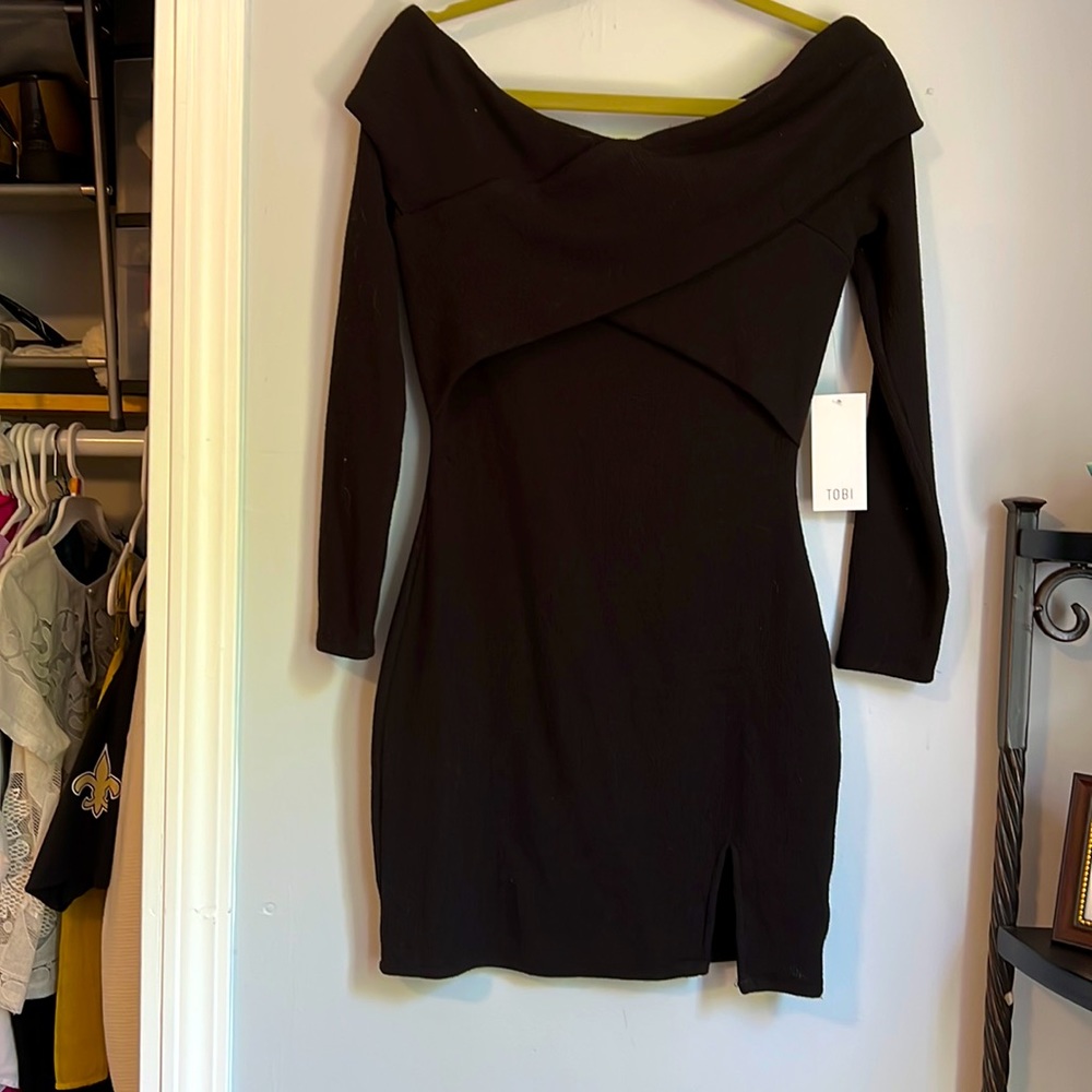 New with tags. Black off the shoulder dress.